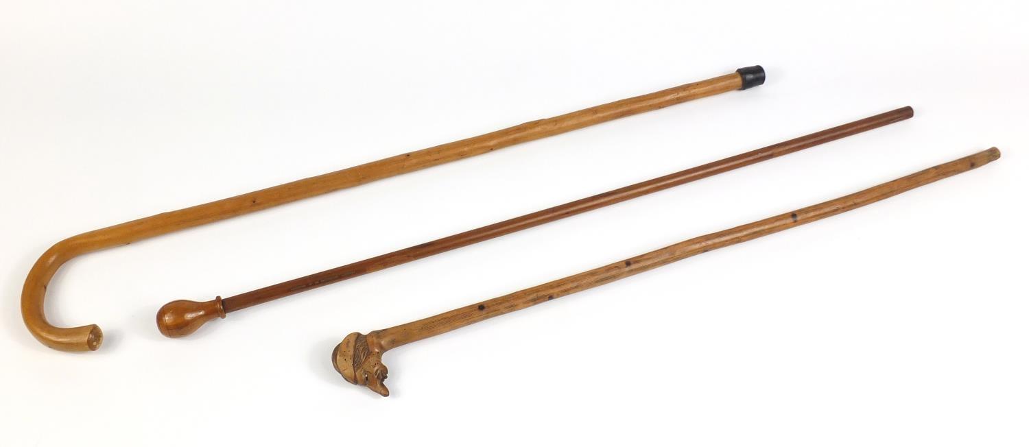 Three wooden walking canes one with carved head handle : For Further Condition Reports Please - Image 4 of 5