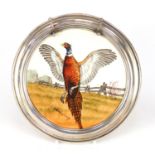 Circular porcelain tray with sterling silver mount, hand painted with a pheasant, indistinctly
