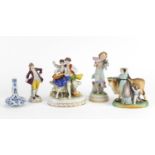 Four continental porcelain figure groups and a delft vase including a courting couple, the largest