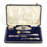 Silver mounted vanity items, housed in a fitted tooled leather case : For Further Condition