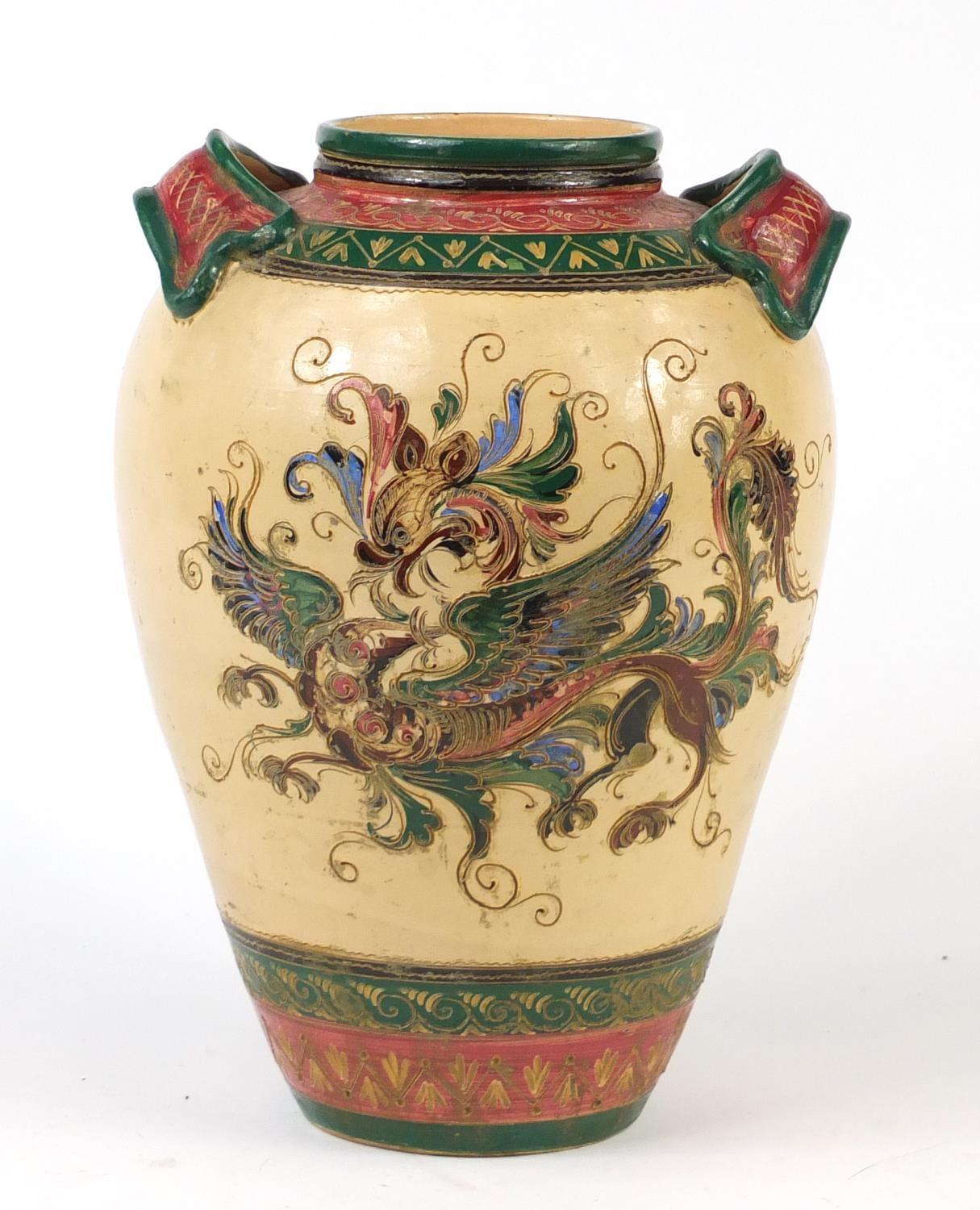 Large Italian pottery twin handled vase, incised and hand painted with dragons, 42cm high : For