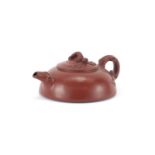Chinese yixing terracotta squatted teapot with naturalistic handle and spout, impressed marks to the