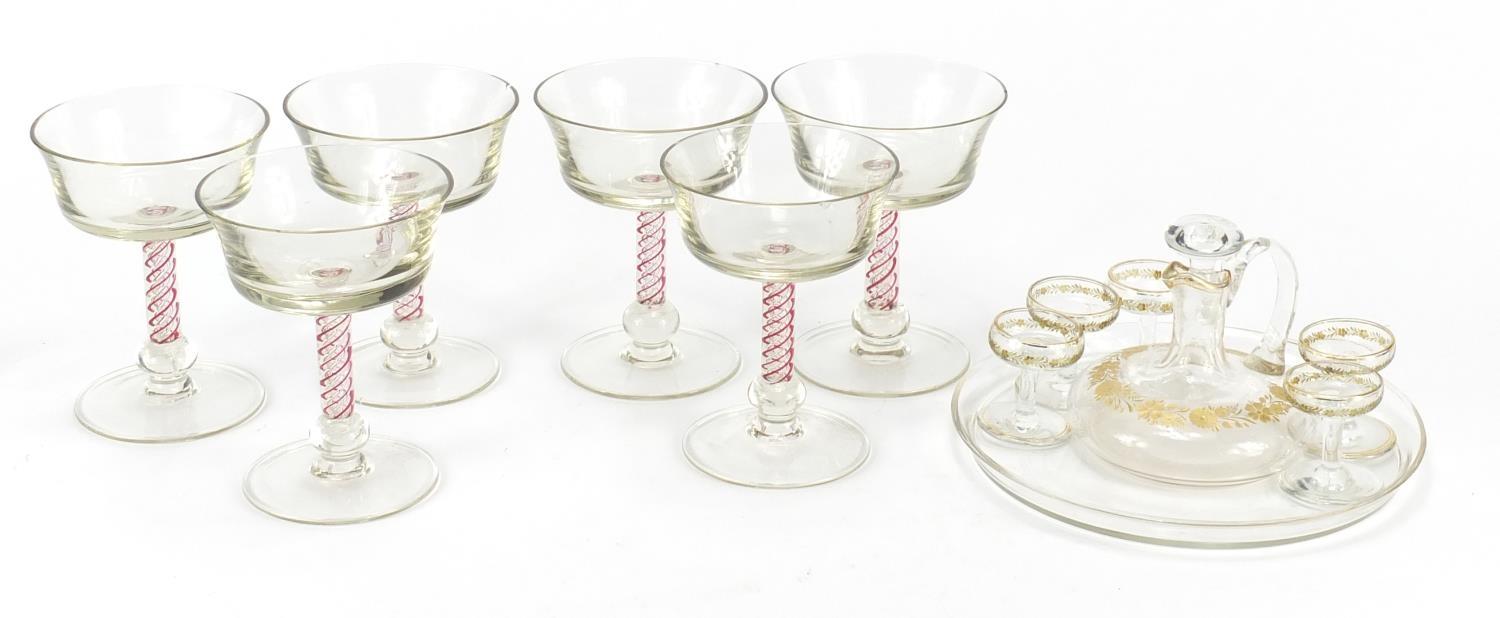 Glassware including a cabaret service, gilded with flowers and six glasses with air twist stems, the