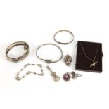 Mostly silver jewellery including a Victorian buckle bracelet, charms and an African bust brooch :