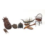 African carved wood wall masks, a horn model boat and doll's chair : For Further Condition Reports