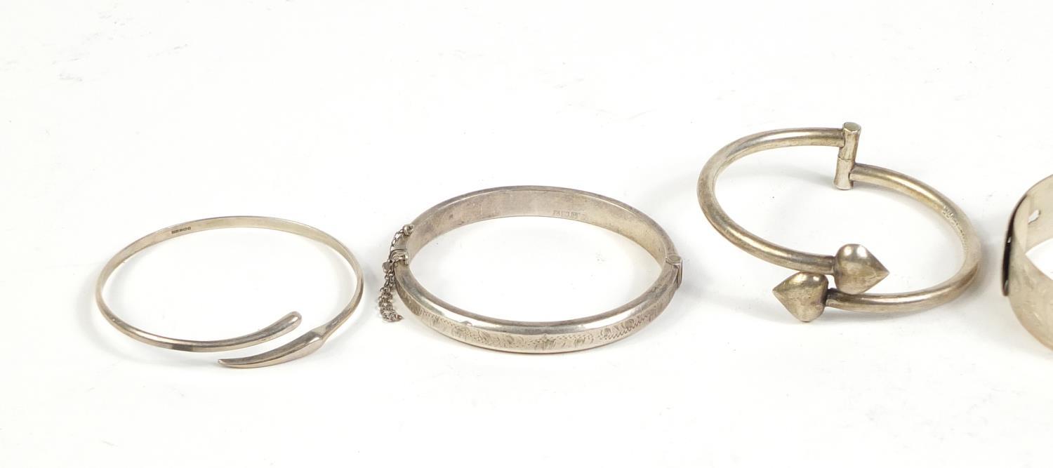 Five silver and white metal bangles, 65.5g : For Further Condition Reports Please visit our - Image 2 of 6