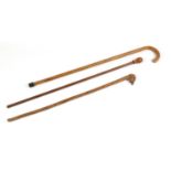 Three wooden walking canes one with carved head handle : For Further Condition Reports Please
