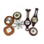 Seven wall hanging barometers, the largest 50cm in length : For Further Condition Reports Please