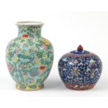 Chinese porcelain vase and jar and cover, both hand painted with flowers, the largest 31cm high :