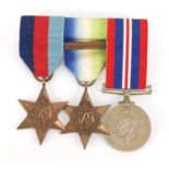 Three British Military World War II medals with ribbons and bar : For Further Condition Reports