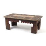 African coffee table carved with figures and animals, with marble insert, 35cm H x 90cm W x 50cm D :