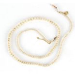 Single string simulated pearl necklace with 9ct gold clasp, 54cm in length : For Further Condition