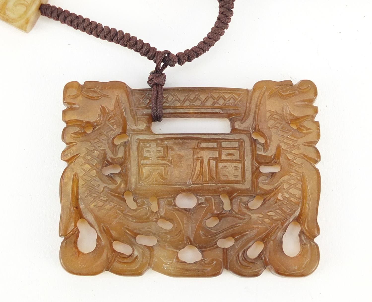 Chinese hardstone pendant on necklace carved with dragons and calligraphy, the pendant 6cm wide : - Image 2 of 3