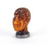 Amber style bust with silver coloured mounts, moulded with nude figures, 7cm high : For Further