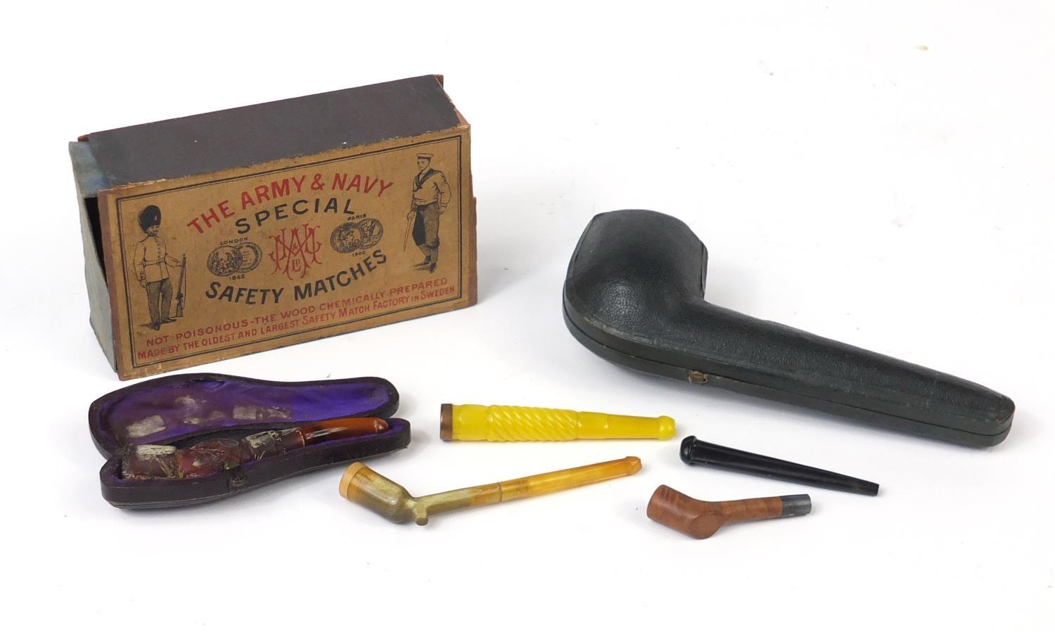 Vintage smoking items including a Meerschaum hand pipe, cheroots and an Army and Navy safety matches