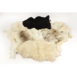Four animal skin rugs, the largest 120cm in length : For Further Condition Reports Please visit