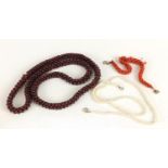 Three necklaces including, garnet, fresh water pearls and corals : For Further Condition Reports