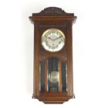 Oak cased wall hanging clock with Westminster chime, 70cm high : For Further Condition Reports