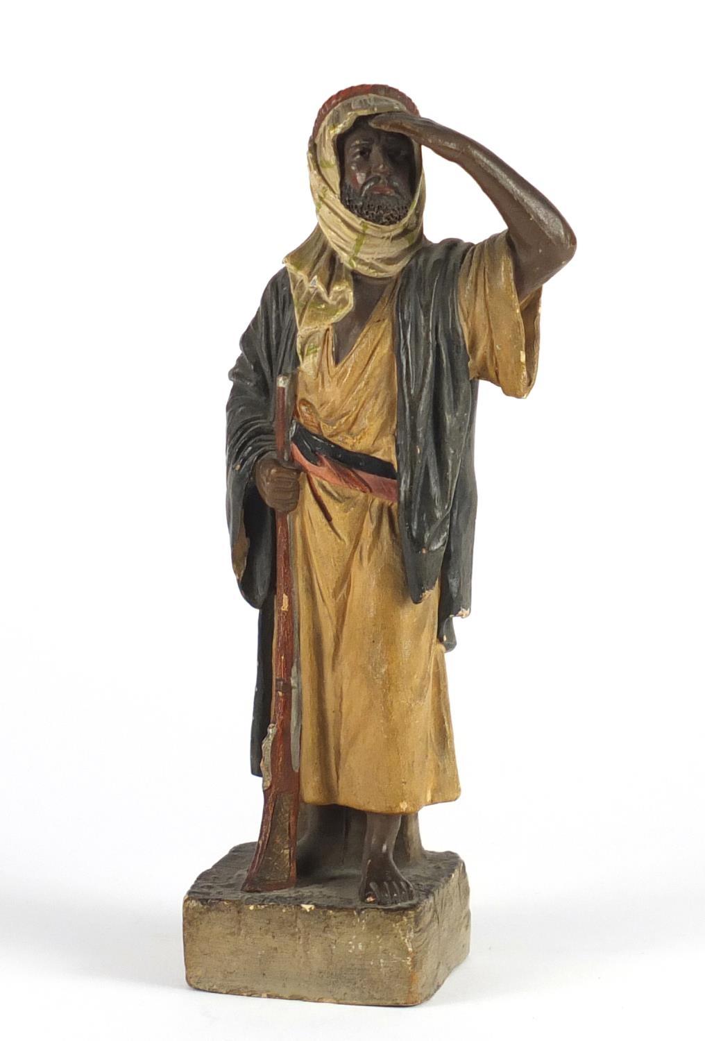 Terracotta figure of an Arab hunter, 22cm high : For Further Condition Reports Please visit our