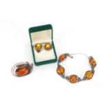 Silver and amber jewellery comprising brooch, bracelet and earrings, the bracelet 16cm in length :