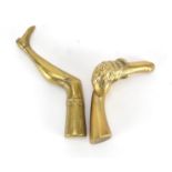 Two Victorian brass pipe tamper's in the form of a ladies leg and a hand holding a phallus, the