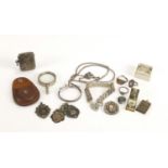 Silver and white metal jewellery and a silver vesta including bracelets, brooches and a sports jewel