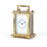 Miniature brass cased carriage clock with enamelled dial inscribed Mignon, 6.5cm high : For