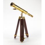 Brass table top telescope raised on stained wood tripod stand : For Further Condition Reports