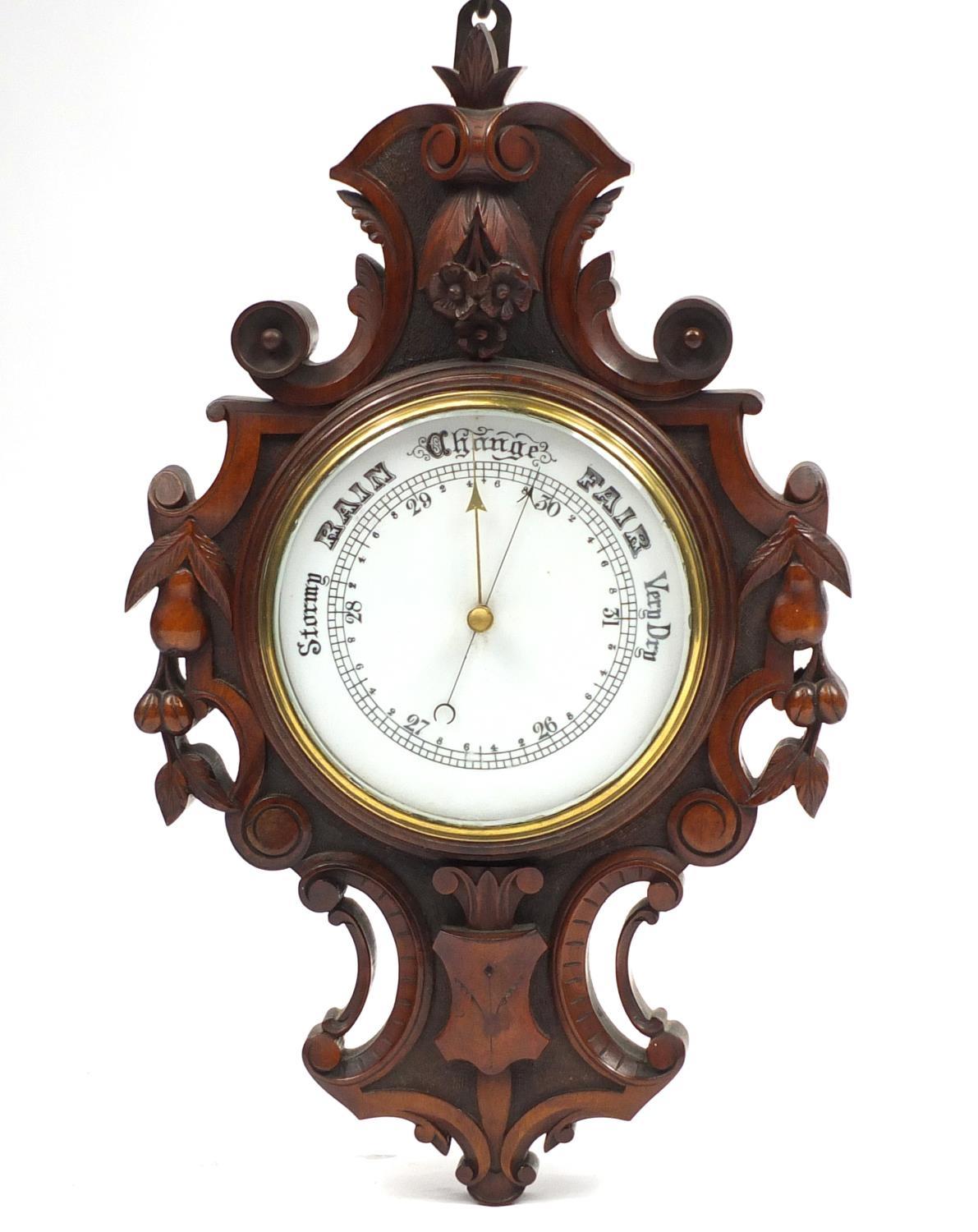 Victorian walnut wall barometer carved with leaves and berries, 58cm high : For Further Condition