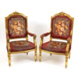 Pair of French design gilt wood elbow chairs with red and floral upholstery, 111cm high : For