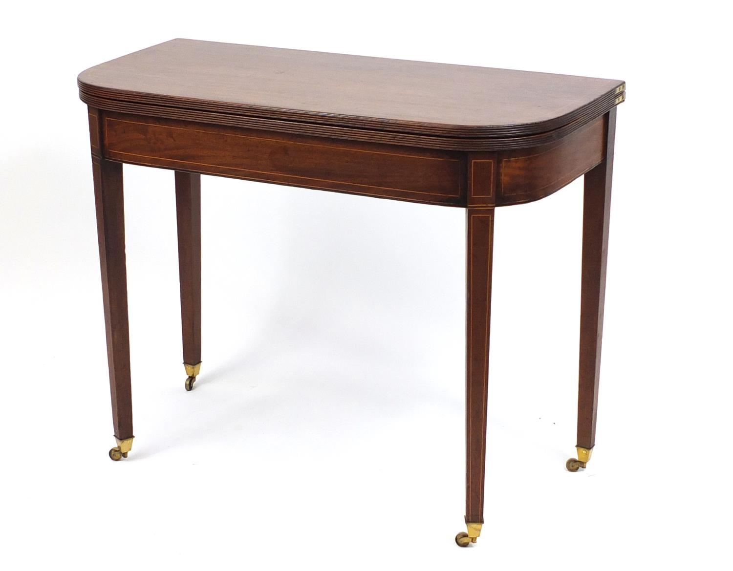 Edwardian inlaid mahogany fold over tea table, raised on tapering legs, 72cm H x 91cm W x 45cm D (