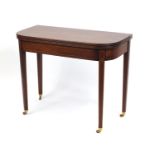 Edwardian inlaid mahogany fold over tea table, raised on tapering legs, 72cm H x 91cm W x 45cm D (
