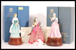 A collection of three Royal Doulton figurines to include Lady Dianna Spencer HN 2885 raised on socle