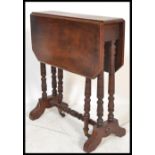 A Victorian mahogany Sutherland table being raised on ring turned legs with drop leaves raised on