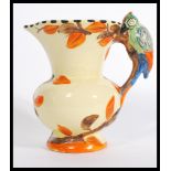 A vintage Wade Heath woodpecker handled jug having hand painted details with makers marks to base.