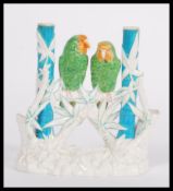 A late 19th Century Victorian Worcester Aesthetic Movement spill vase featuring a pair of