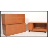 A retro 20th Century teak wood three piece modular wall unit in the manner of Avalon consisting of a
