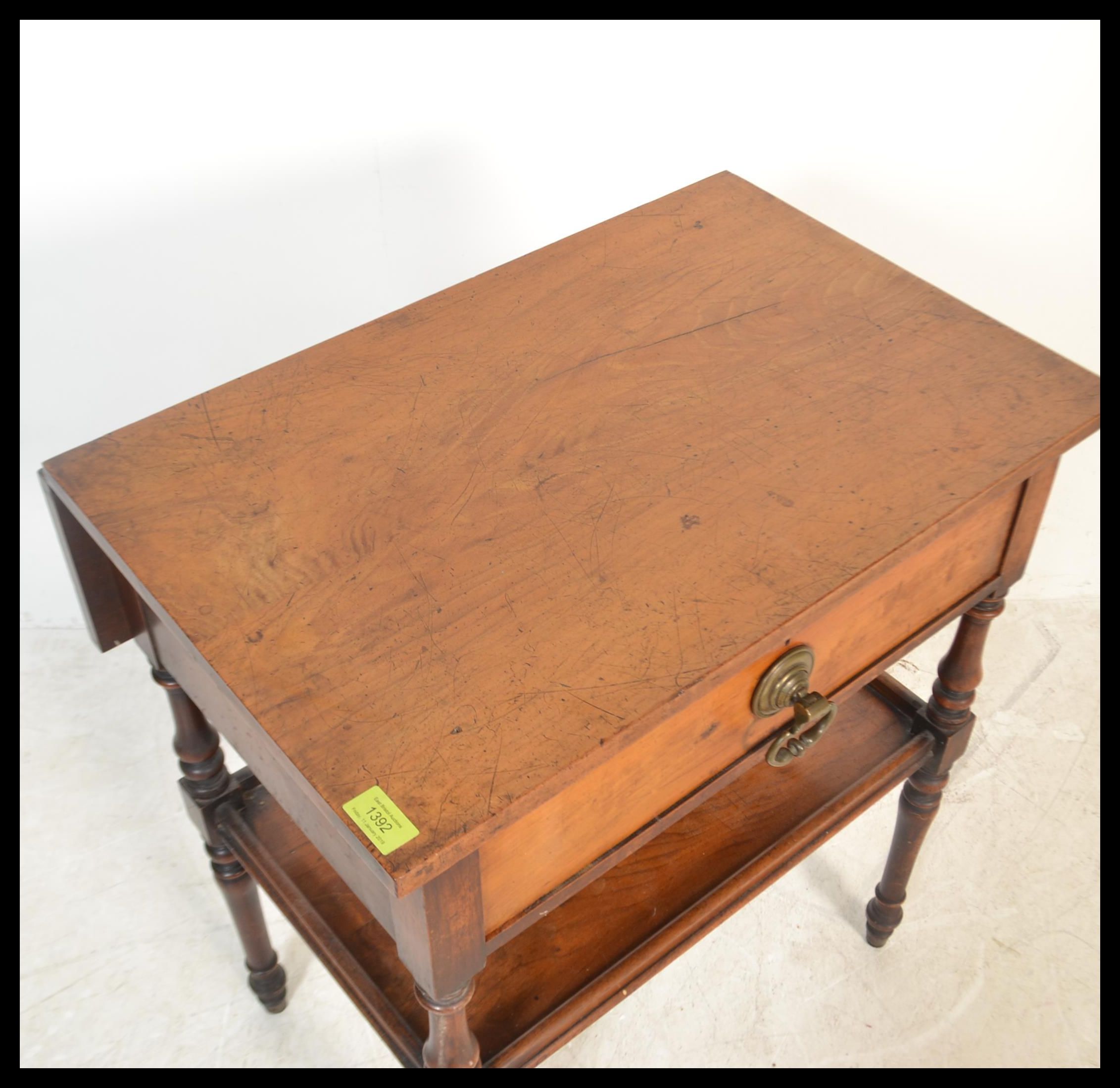 A Victorian mahogany side / lamp table being raised on turned legs with lower tier under single - Image 4 of 6