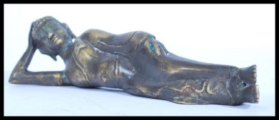 A 20th Century bronze figure ornament of a reclining Asian Diety. Measures 23cm high.
