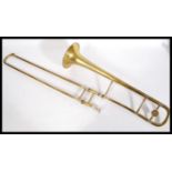 A 20th Century brass J. R. Lafleur & Sons trumpet no. 17276 in a leather carrying case, with