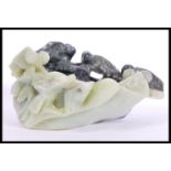 An unusual Chinese large jade / soapstone carved bowl depicting various big eyed fish in deep