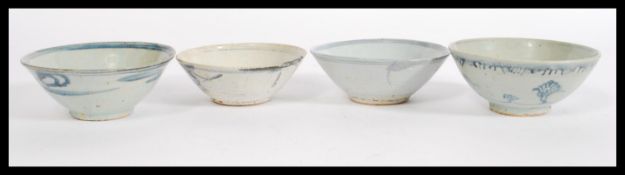 A group of four late 18th Century / early 19th Century Chinese ceramic bowls having white glaze