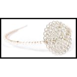 A vintage early 20th Century white rhinestone and freshwater pearl headband Harlow headpiece with
