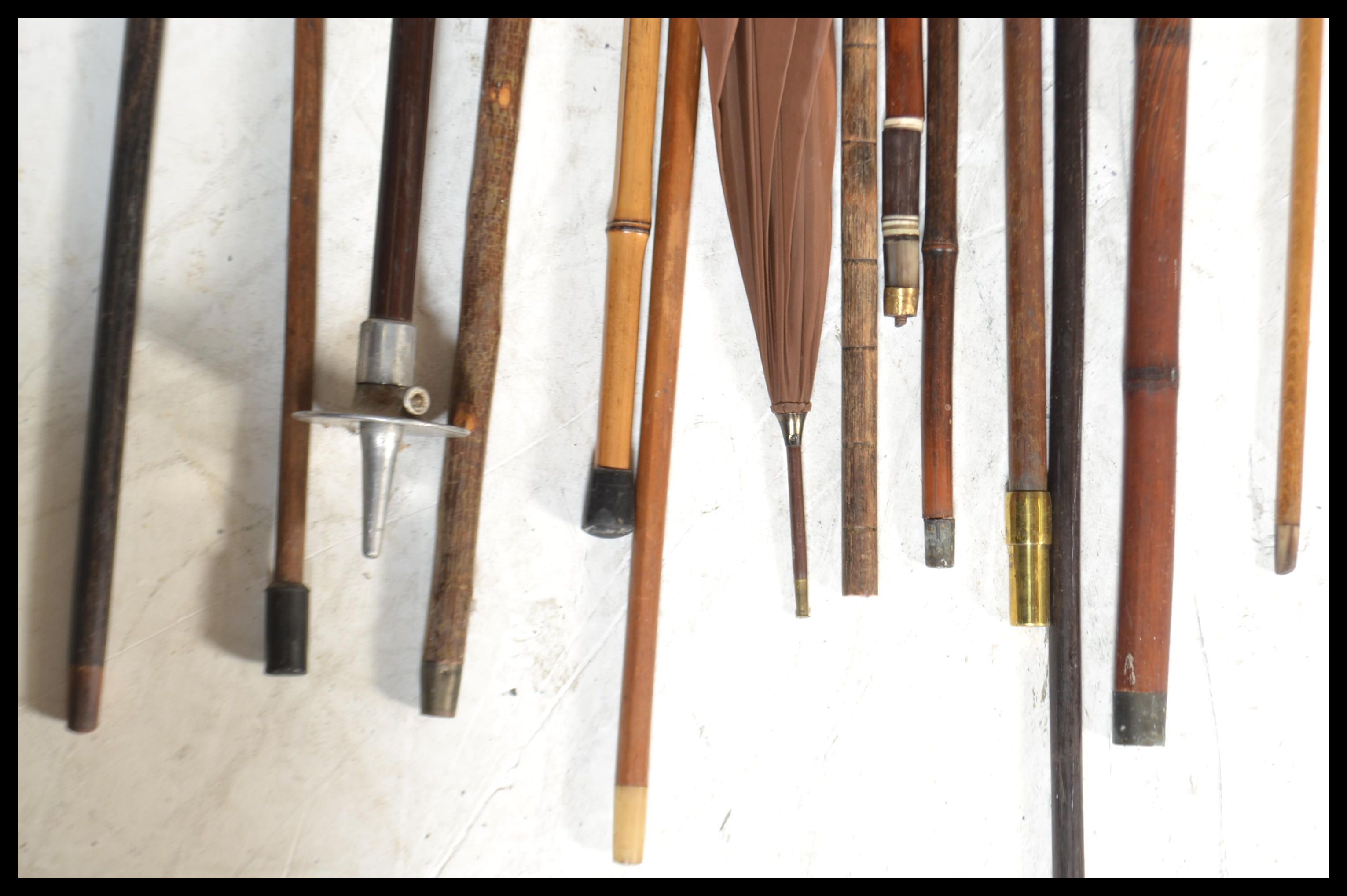 A collection of various designed walking canes dating from the late 19th / early 20th Century to - Image 4 of 4