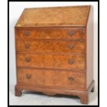 A  good Queen Anne revival burr walnut fall front bureau, fully appointed interior raised over