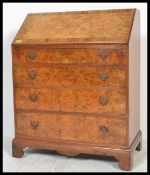 A  good Queen Anne revival burr walnut fall front bureau, fully appointed interior raised over