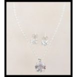 A sterling silver demi parure suite set of cz jewellery to include a pair of stud earrings and