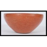 An ancient antique Roman pottery bowl. Simple red