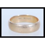 A hallmarked 9ct gold band ring of plain form baring London hallmarks. Weighs 6 grams. Size X.