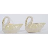 A pair of vintage 20th century Belleek ceramic creamer jugs in the form of swans. Green printed